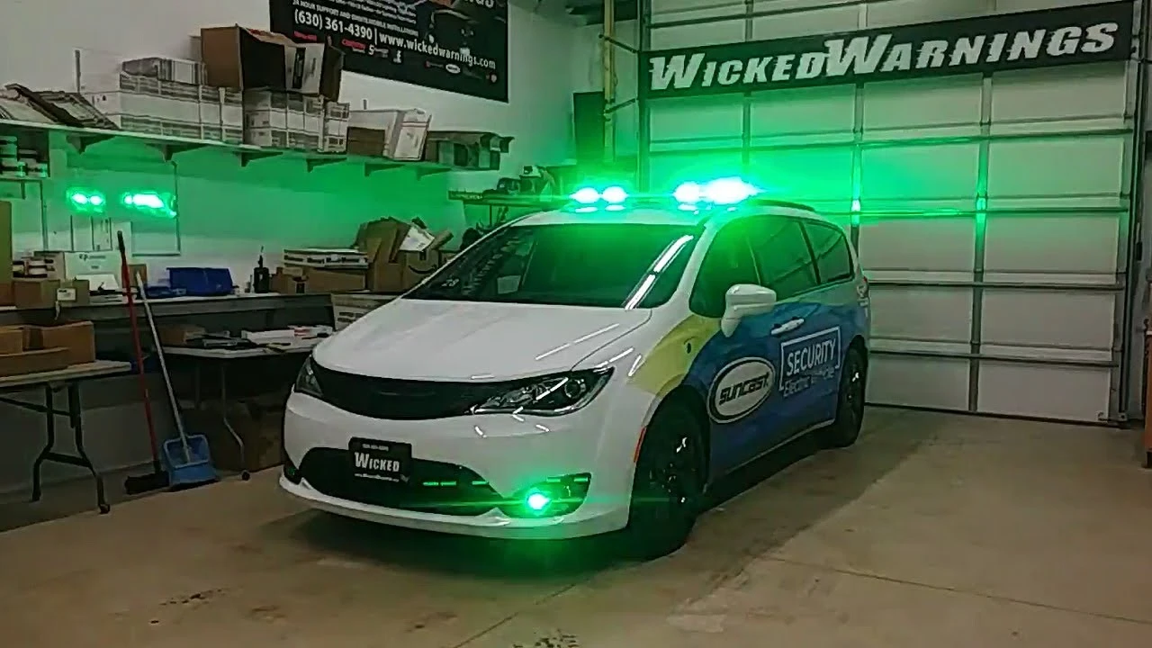 A van displaying green emergency lights on its side indicating a non emergency response vehicle in action