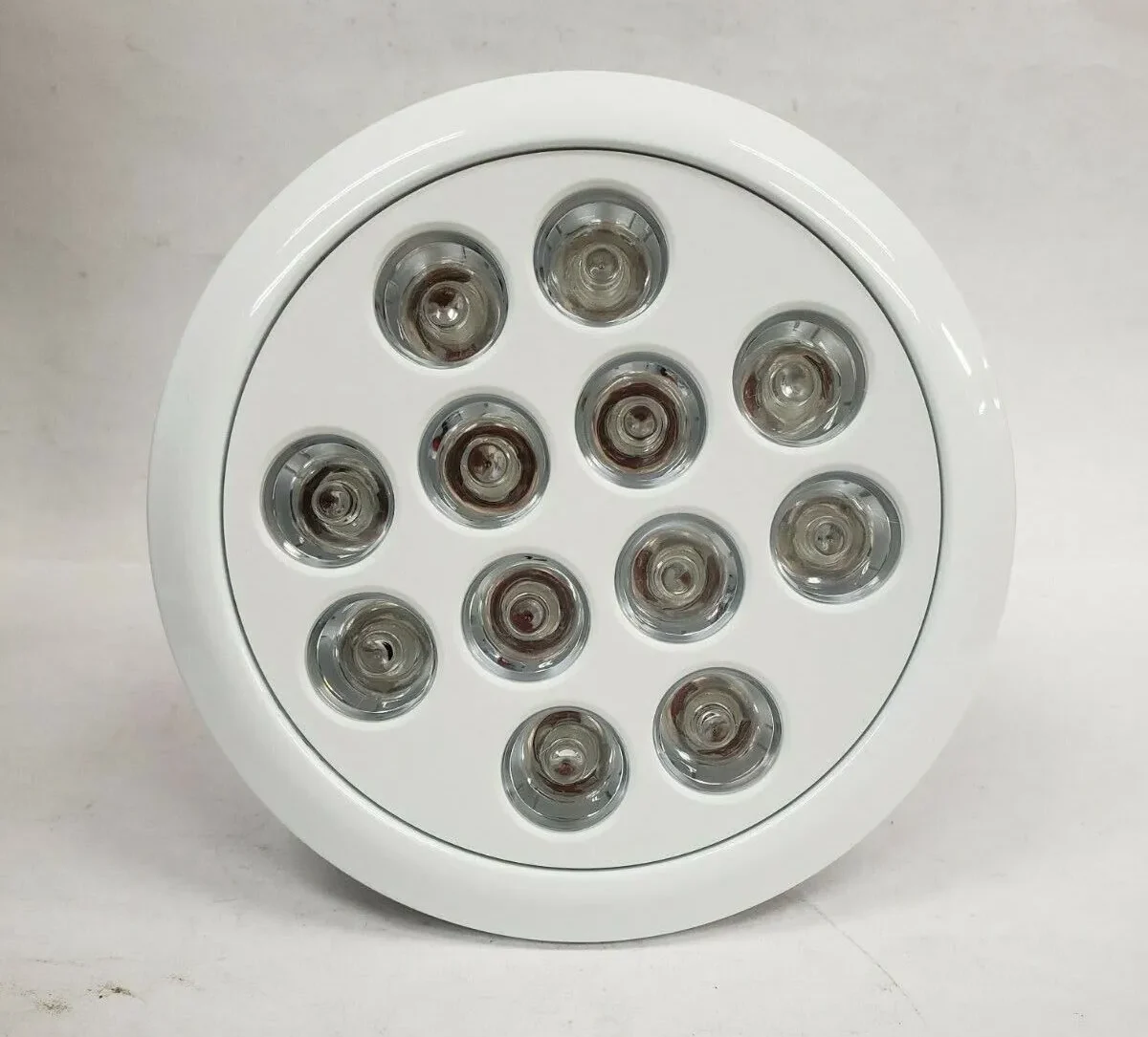 A white round light featuring six individual lights designed for optimal plant growth labeled as Unifun Grow Light